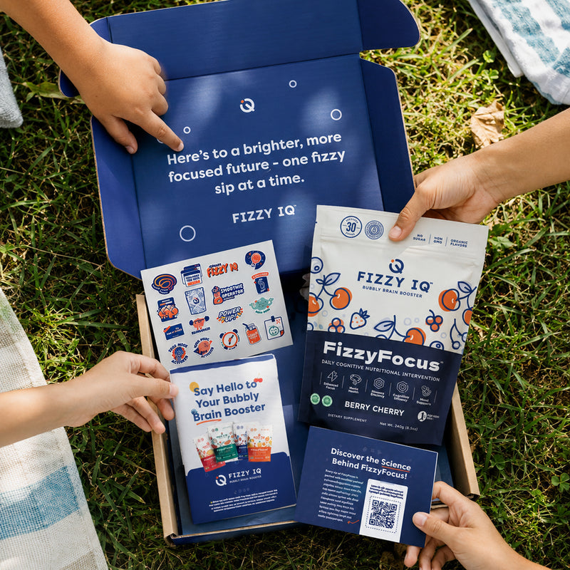 Family hands opening a FizzyFocus box with a Berry Cherry pouch and welcome cards